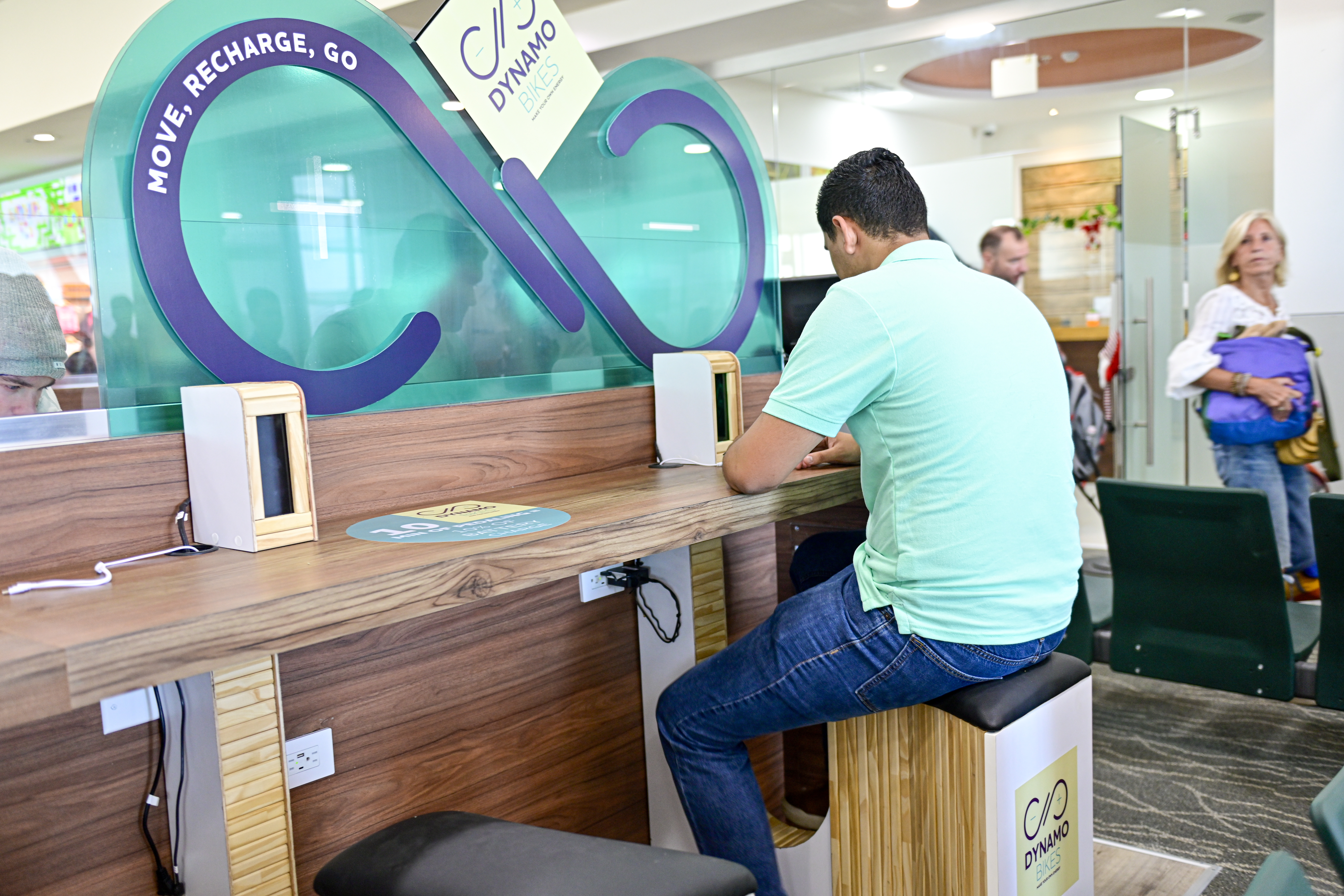 Passengers get pedaling to charge their mobile phones at Guanacaste Airport